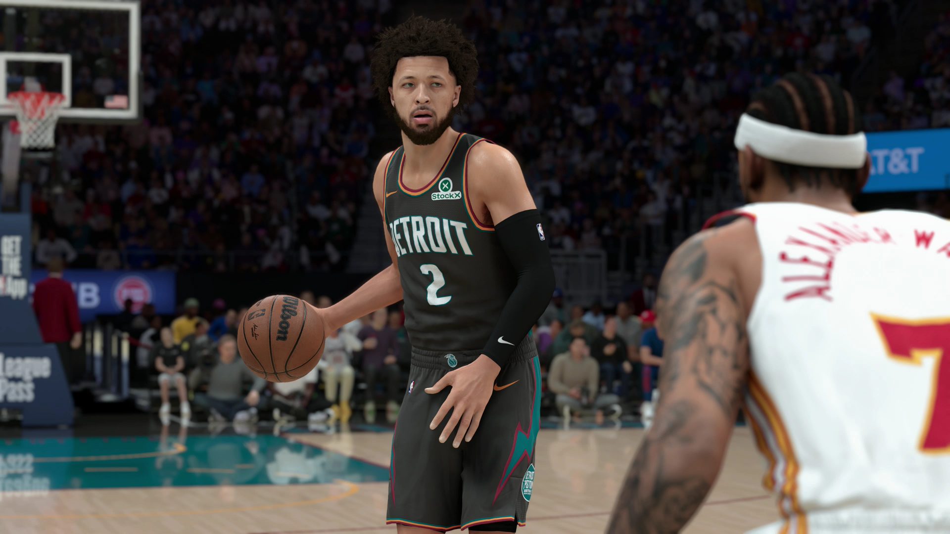 In a screenshot from NBA 2K26, Detroit Pistons guard Cade Cunningham dribbles the basketball up the court against Atlanta Hawks guard Nickeil Alexander-Walker.